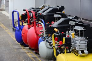 a row of air compressors pumps of different sizes